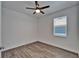 Enjoy this bedroom with a ceiling fan and a window allowing for natural light at 6097 Vermont Ave, New Port Richey, FL 34653