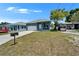 Beautiful one-story home with a well-kept lawn and long driveway, blending comfort and style at 6097 Vermont Ave, New Port Richey, FL 34653
