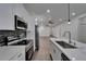Well-designed kitchen with stainless steel appliances, granite countertops, modern cabinetry, and an open layout at 6097 Vermont Ave, New Port Richey, FL 34653