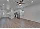Modern kitchen featuring stainless steel appliances, white cabinetry, and a spacious island with stylish pendant lighting at 6097 Vermont Ave, New Port Richey, FL 34653