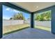 Covered patio overlooking a lush, fenced backyard with a well-manicured lawn at 6097 Vermont Ave, New Port Richey, FL 34653