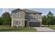 Charming two-story home with attached two-car garage and manicured front lawn, offering curb appeal at 6517 Propel Run, New Port Richey, FL 34655