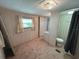 A small bedroom featuring a window, access to the bathroom, and a closet for storage at 663 54Th S Way # 146, Gulfport, FL 33707