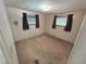 Bedroom with dark curtains and a wall unit at 663 54Th S Way # 146, Gulfport, FL 33707