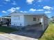 Single-story home with carport, quaint yard and charming curb appeal at 663 54Th S Way # 146, Gulfport, FL 33707