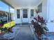 Inviting front entry showcasing a well-lit porch and colorful landscaping at 663 54Th S Way # 146, Gulfport, FL 33707