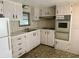 Efficient kitchen layout with ample cabinet space and built in oven at 663 54Th S Way # 146, Gulfport, FL 33707