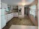 Functional kitchen with ample cabinet space, built-in oven and adjacent eating area at 663 54Th S Way # 146, Gulfport, FL 33707