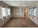Bright living room featuring neutral walls, carpet, and many windows allowing ample natural light at 663 54Th S Way # 146, Gulfport, FL 33707