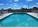 Outdoor swimming pool with lounge chairs and well-kept deck at 663 54Th S Way # 146, Gulfport, FL 33707