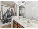 Well-lit bathroom features a double sink vanity, tub/shower, and ample counter space at 7705 S Sparkman St, Tampa, FL 33616