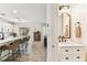 Stylish half bathroom with marble countertops, custom mirror, and shiplap details adjacent to the kitchen at 7705 S Sparkman St, Tampa, FL 33616