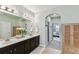 Bathroom with double sink vanity and modern lighting at 7705 S Sparkman St, Tampa, FL 33616