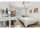 Bedroom with a work area, neutral walls, ceiling fan and lots of natural light at 7705 S Sparkman St, Tampa, FL 33616