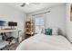 Cozy bedroom with natural light, desk, and shelving, perfect for relaxation and productivity at 7705 S Sparkman St, Tampa, FL 33616