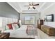 Bedroom with king bed, ceiling fan, and large window at 7705 S Sparkman St, Tampa, FL 33616