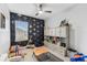 Playful bedroom with airplane wallpaper, cozy seating, and plenty of storage at 7705 S Sparkman St, Tampa, FL 33616