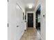 Foyer leading into the home, with an entry door, storage cabinet, and adjacent office space at 7705 S Sparkman St, Tampa, FL 33616