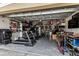 Garage setup with exercise equipment, storage, and recreational items at 7705 S Sparkman St, Tampa, FL 33616