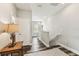 Hallway with hard wood flooring and access to stairs at 7705 S Sparkman St, Tampa, FL 33616