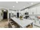 Well-lit kitchen with an island, stainless steel appliances, and ample counter space at 7705 S Sparkman St, Tampa, FL 33616