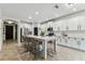 Large kitchen features two islands with seating, stainless appliances, and generous cabinet space at 7705 S Sparkman St, Tampa, FL 33616