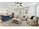 Bright living room with neutral tones, stylish sofas, ceiling fan and plenty of natural light at 7705 S Sparkman St, Tampa, FL 33616