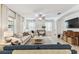 Elegant living room with tile floors, neutral tones, and natural light from large windows at 7705 S Sparkman St, Tampa, FL 33616