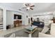 Open living space showcasing a bright floor plan with the kitchen and modern tile flooring at 7705 S Sparkman St, Tampa, FL 33616