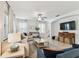 Bright living room featuring neutral décor, recessed lighting and tile flooring at 7705 S Sparkman St, Tampa, FL 33616