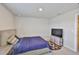Bedroom featuring a bed, desk, and TV on a dresser at 7709 Imagination Pl, Wesley Chapel, FL 33545