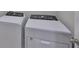 Laundry room featuring a new white Whirlpool washer and dryer at 7709 Imagination Pl, Wesley Chapel, FL 33545