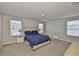 Serene main bedroom with plush carpeting, ample natural light, and neutral decor at 7709 Imagination Pl, Wesley Chapel, FL 33545