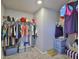 Organized walk-in closet with ample storage space for clothing and accessories at 7709 Imagination Pl, Wesley Chapel, FL 33545