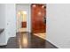 Hallway featuring hardwood floors and access to a bathroom and kitchen area at 777 N Ashley Dr # 2608, Tampa, FL 33602
