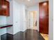 Hallway featuring built-in desk, storage cabinets, and access to a full bathroom at 777 N Ashley Dr # 2608, Tampa, FL 33602