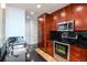 Modern kitchen with sleek stainless steel appliances, dark countertops, and plenty of cabinet space at 777 N Ashley Dr # 2608, Tampa, FL 33602