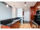 Modern kitchen with stainless steel appliances and tiled backsplash and countertop at 777 N Ashley Dr # 2608, Tampa, FL 33602