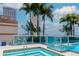 Inviting jacuzzi connected to the rooftop pool, set against a backdrop of swaying palms and city buildings at 777 N Ashley Dr # 2608, Tampa, FL 33602