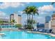 Beautiful rooftop pool area with lounge chairs and palm trees overlooking the city at 777 N Ashley Dr # 2608, Tampa, FL 33602