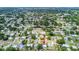 This aerial shot shows a charming neighborhood; an arrow indicates the property's position at 8528 Iris Ave, Seminole, FL 33777