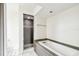 Bathroom featuring a built-in tub and a modern shower with updated fixtures at 8528 Iris Ave, Seminole, FL 33777