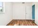 Bright bedroom with wood-look floors and neutral colored walls at 8528 Iris Ave, Seminole, FL 33777
