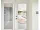 Doors leading to a screened in patio with a decorative rug at 8528 Iris Ave, Seminole, FL 33777