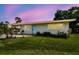 Inviting single-Gathering home with a lush front yard, fresh landscaping, and cheerful curb appeal at 8528 Iris Ave, Seminole, FL 33777