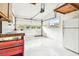 Spacious garage includes a workbench, refrigerator and an automatic door at 8528 Iris Ave, Seminole, FL 33777