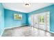 Bright living room featuring tile floors, a window, and French doors to a patio at 8528 Iris Ave, Seminole, FL 33777