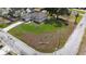 Corner lot property features a well-manicured lawn, concrete driveway, and a two-car garage at 9416 Bullfrog Court, Gibsonton, FL 33534