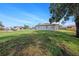 The home features a covered patio, and a large backyard at 9416 Bullfrog Court, Gibsonton, FL 33534