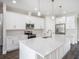 A kitchen featuring a large island with a sink and stainless steel appliances at 9416 Bullfrog Court, Gibsonton, FL 33534